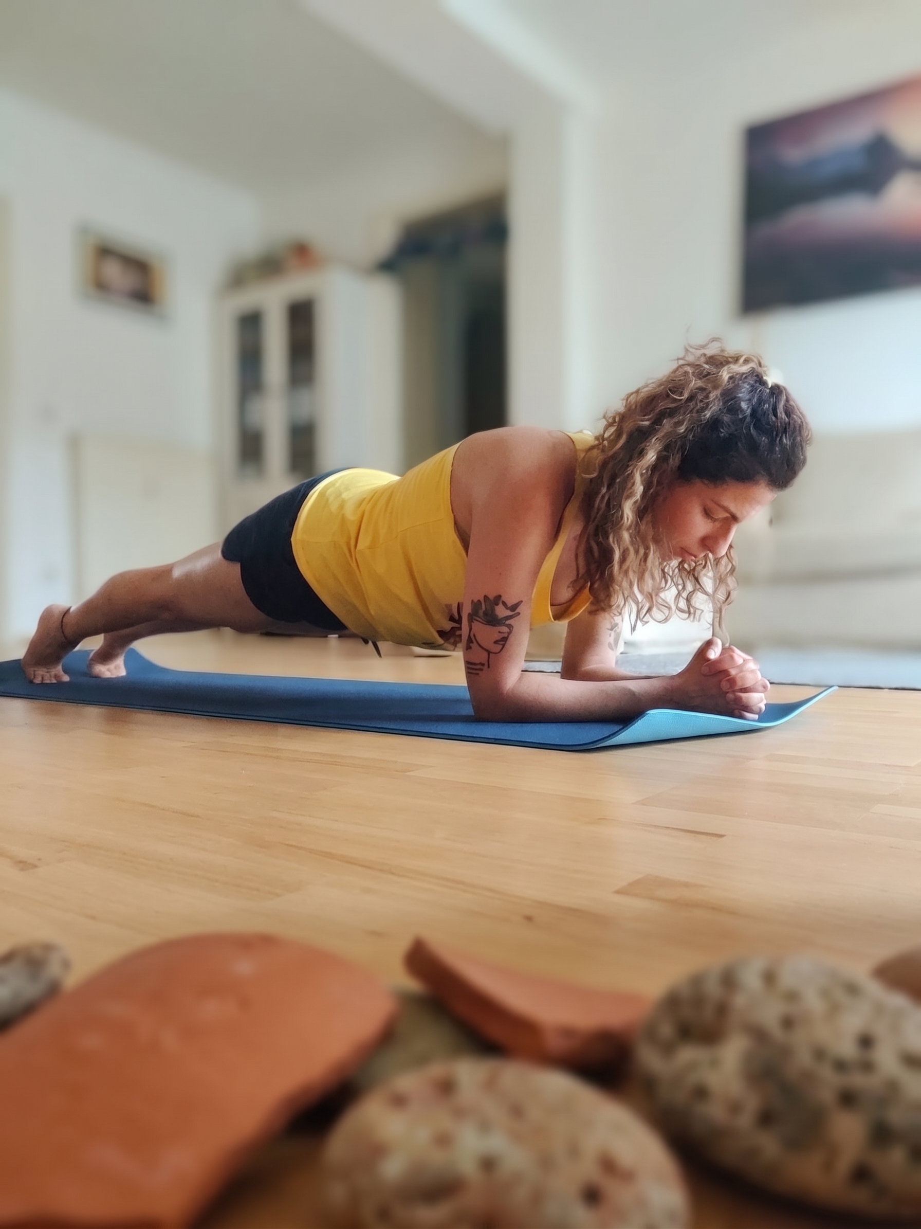 Ritika Arora in plank pose on a yoga mat