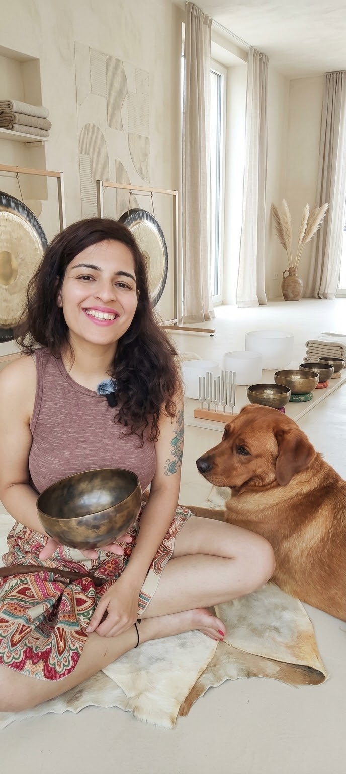 Ritika Arora holding a Tibetan singing bowl with her dog